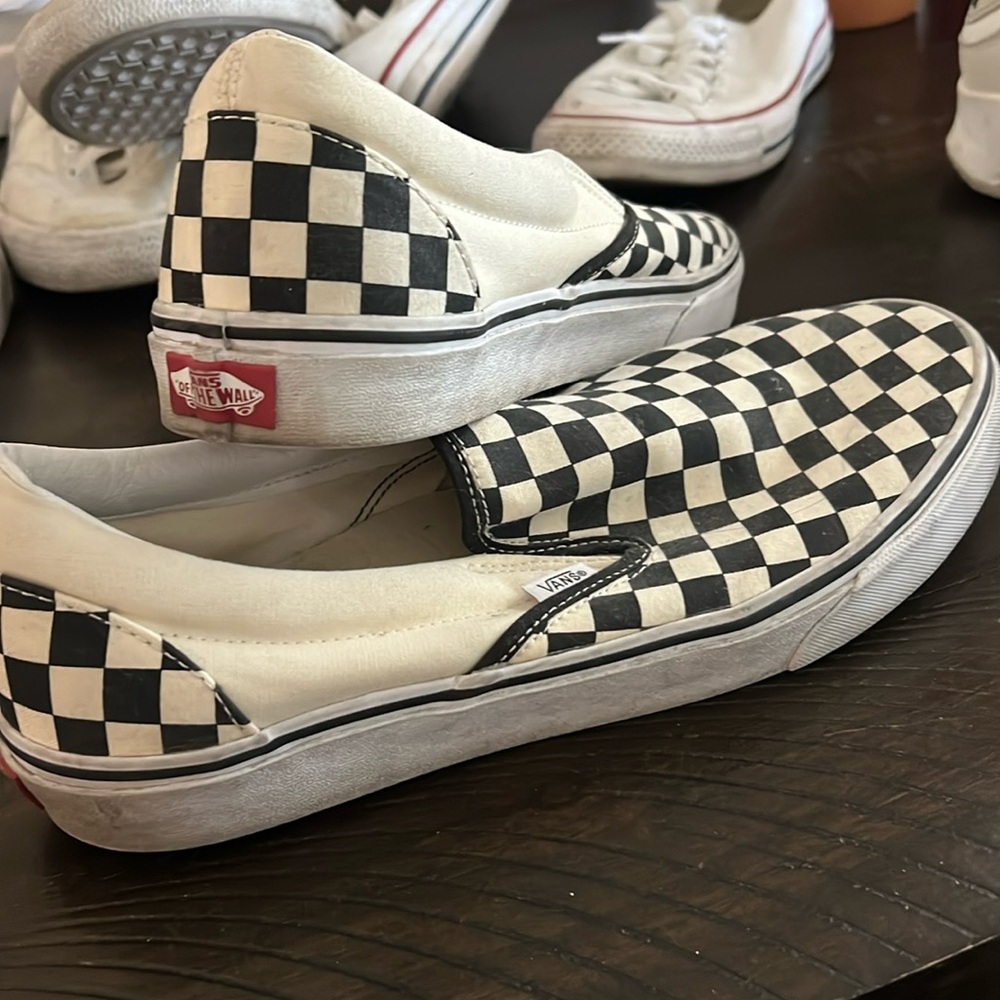 Vans checked slip on shoe. Normal wear and tear. Size 10.5